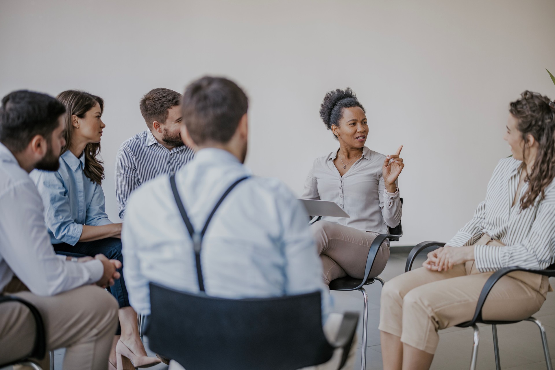 Group psychotherapy session in modern office setting